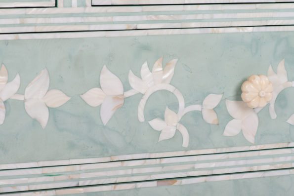 Pink Floral design on a light blue painted chest,