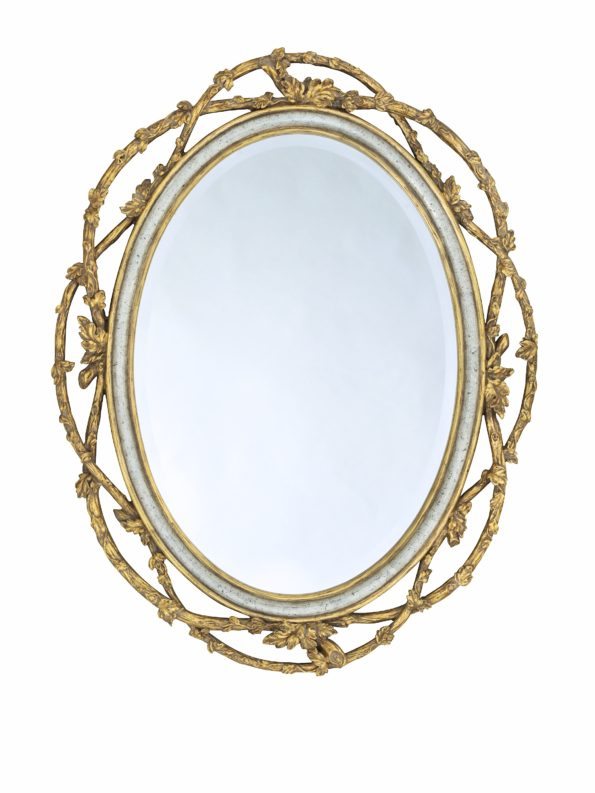 Gold trimmed floral framed mirror for home decor.