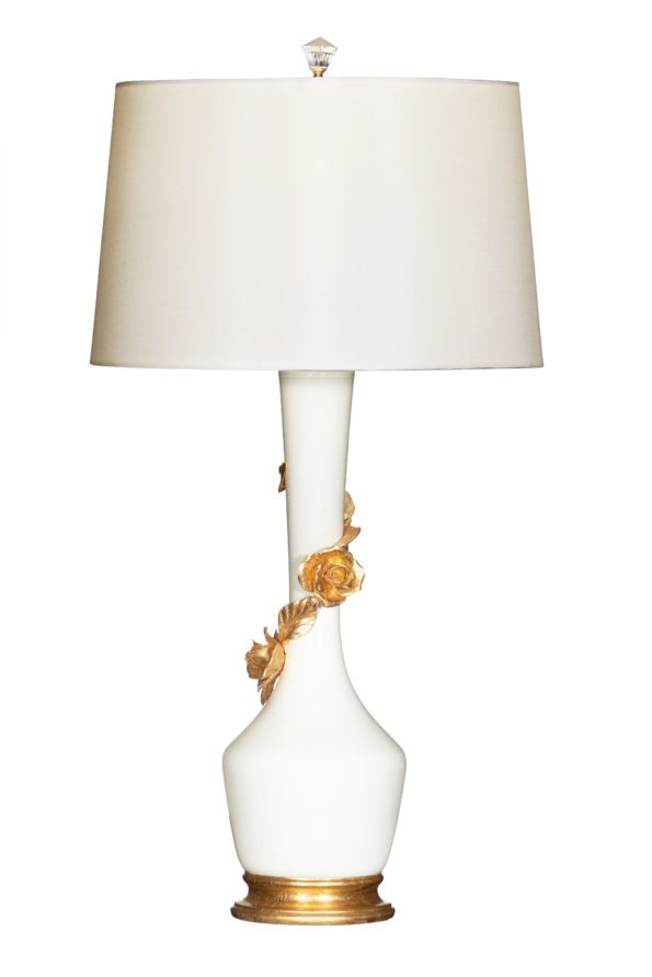 Gold floral design adorns white lamp. 