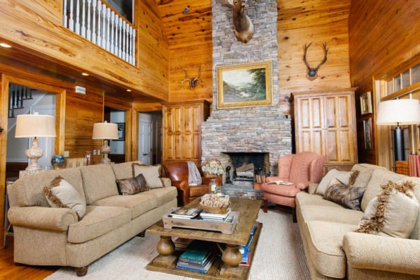 This country cabin decor is finished with books on the coffee table to make it feel lived in. 