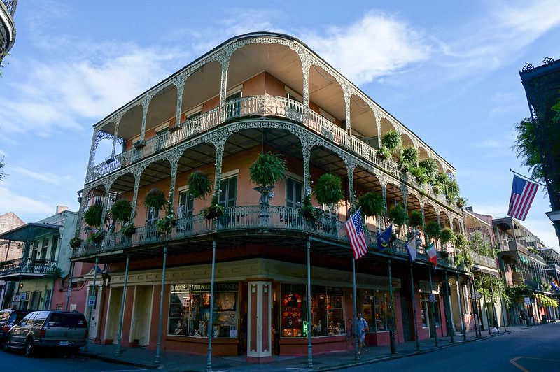 Southern Artists Opportunities in New Orleans, LA - A large building with a clock on the side of a road with French Quarter in the background - Mixed-use