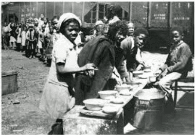 What it Means to Eat “Affrilachian” or Black and Appalachian - A group of people standing in front of a building - Osage